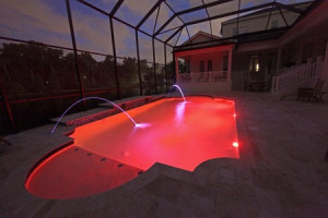 38603315 - a swimming pool lit up at night